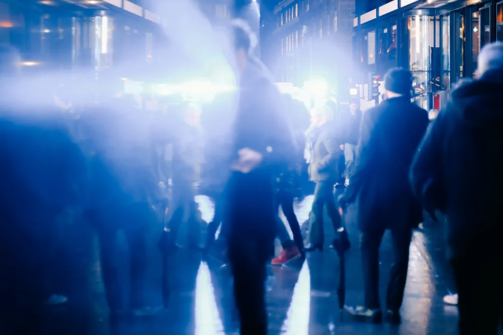 artistic film shot of people walking on the street